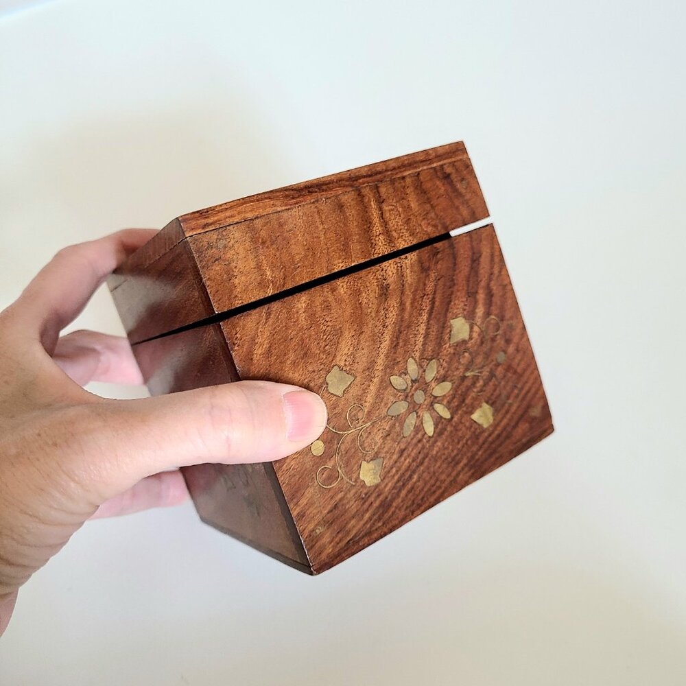 Vintage wooden trinket /jewelry box with brass floral inlay.